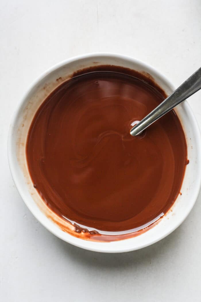 Melted dark chocolate in bowl