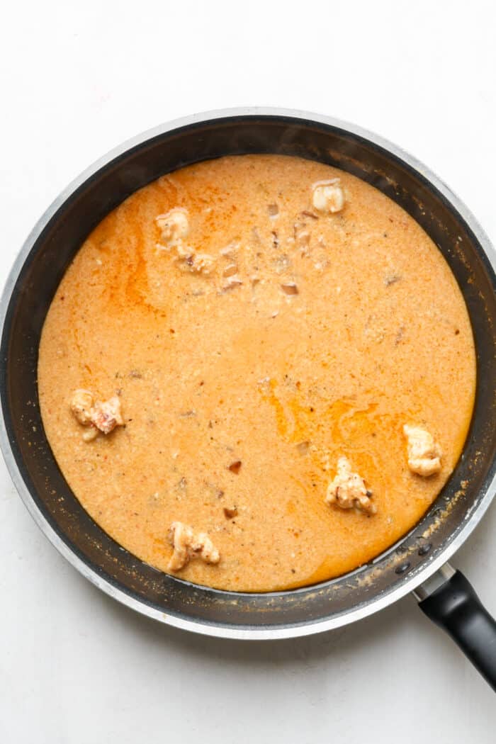 Orange sauce in pan