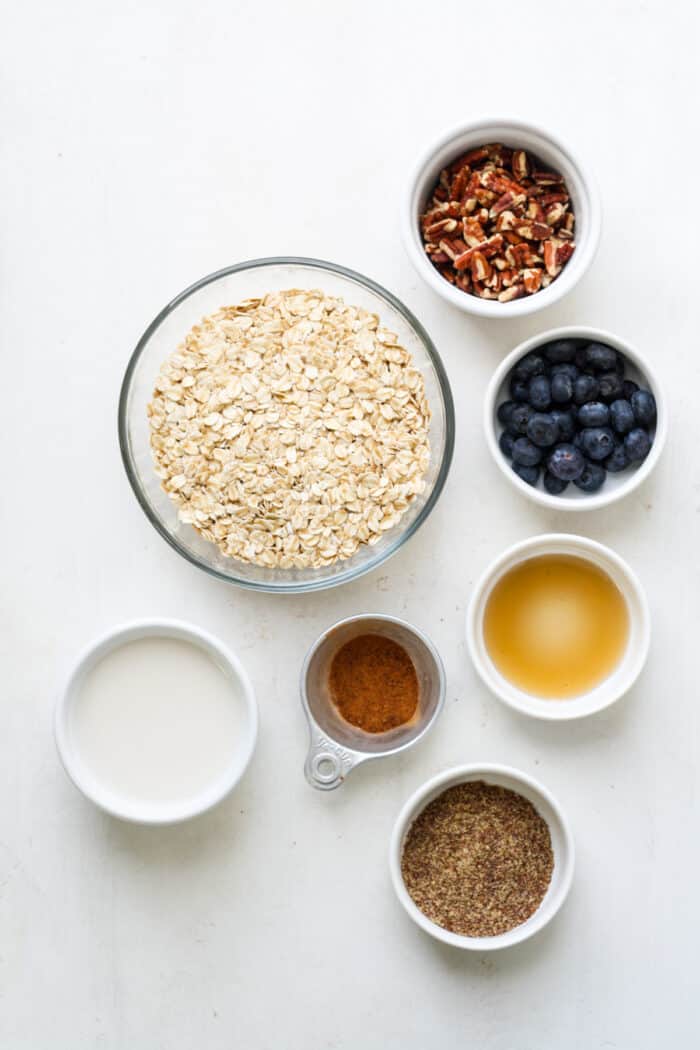 Ingredients in white bowls for oats