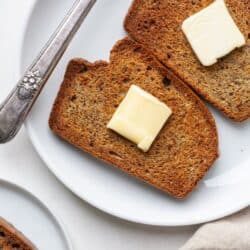 Air fryer toast on plate with butter