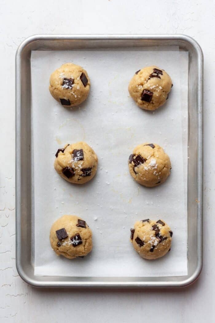 Olive oil cookie dough balls on pan