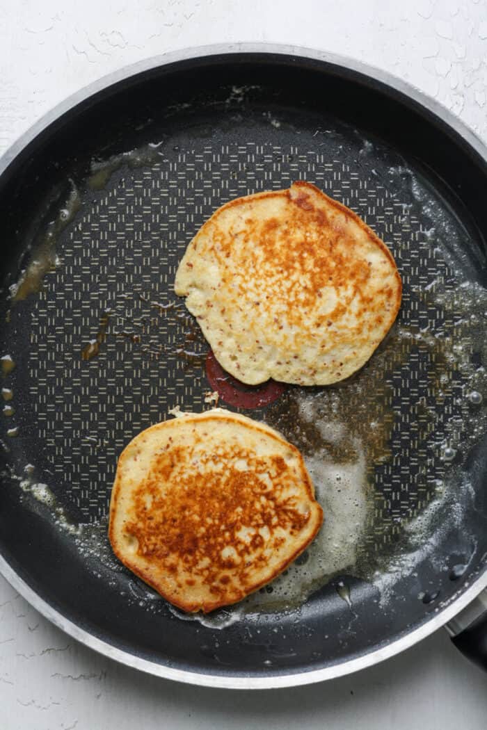 Golden pancakes in pan