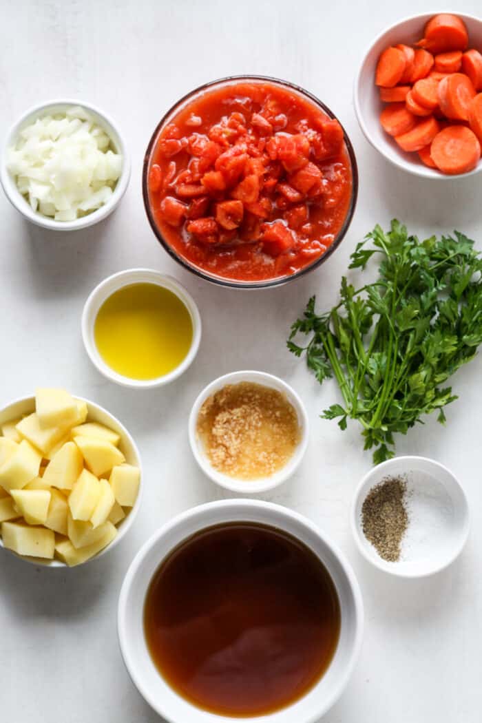 Ingredients in small bowls with tomatoes