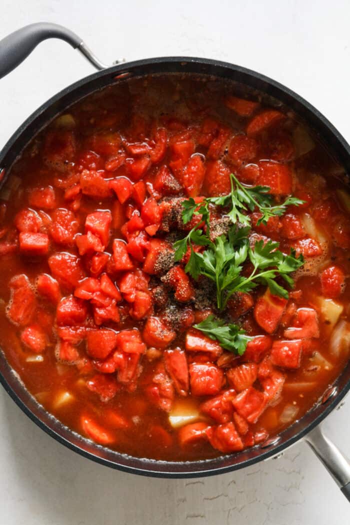 Tomatoes and veggies in skillet