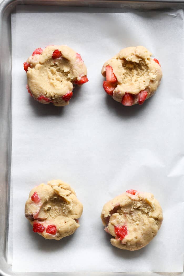 Indents in strawberry cookie dough balls