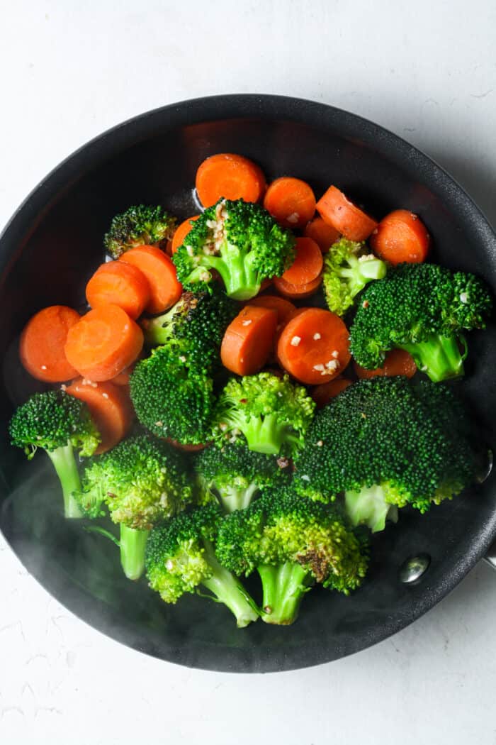 Broccoli and carrots in pan