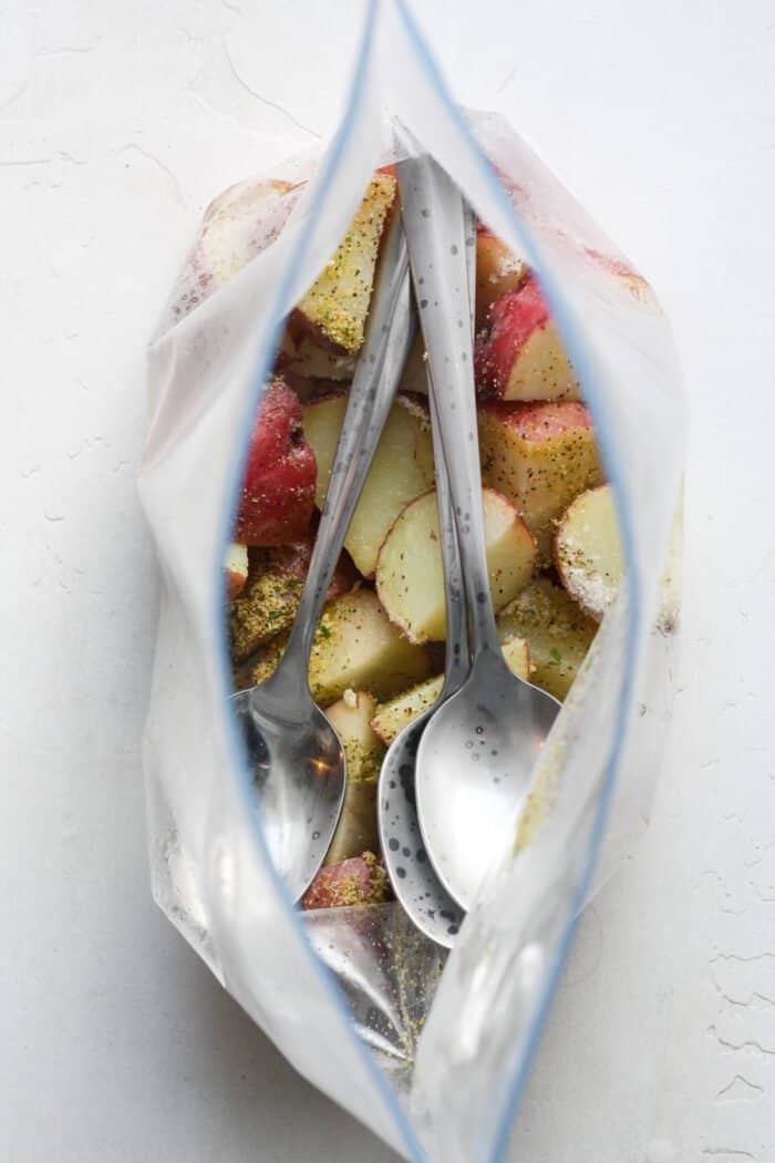 Potatoes in bag with silverware