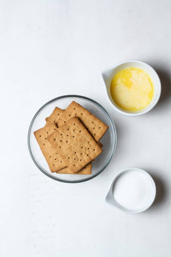 Little bowls of ingredients with gluten free graham crackers