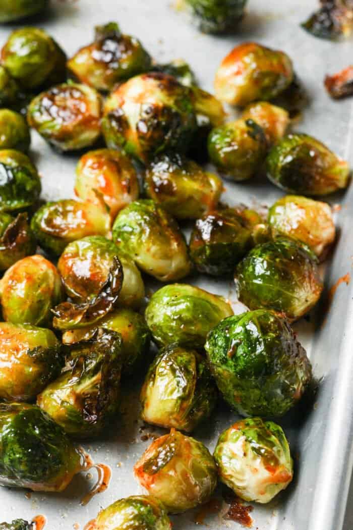 Honey sriracha Brussels sprouts on pan