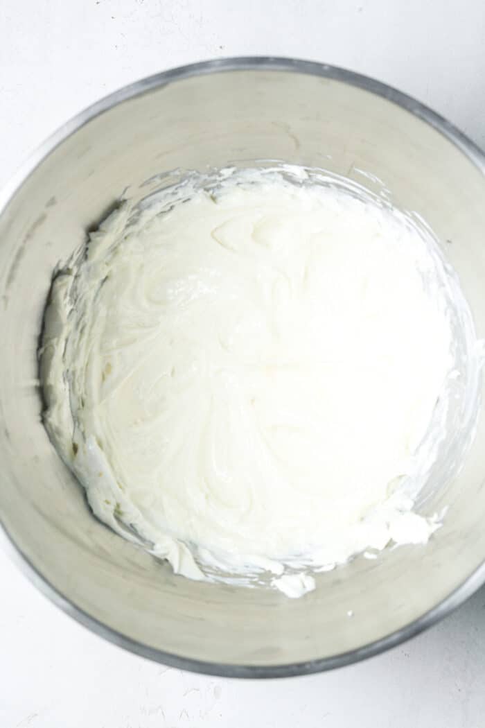 Creamy cheesecake filling in bowl