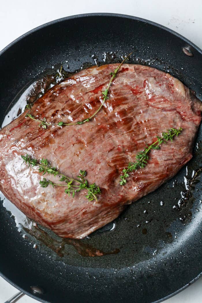Seared steak in pan