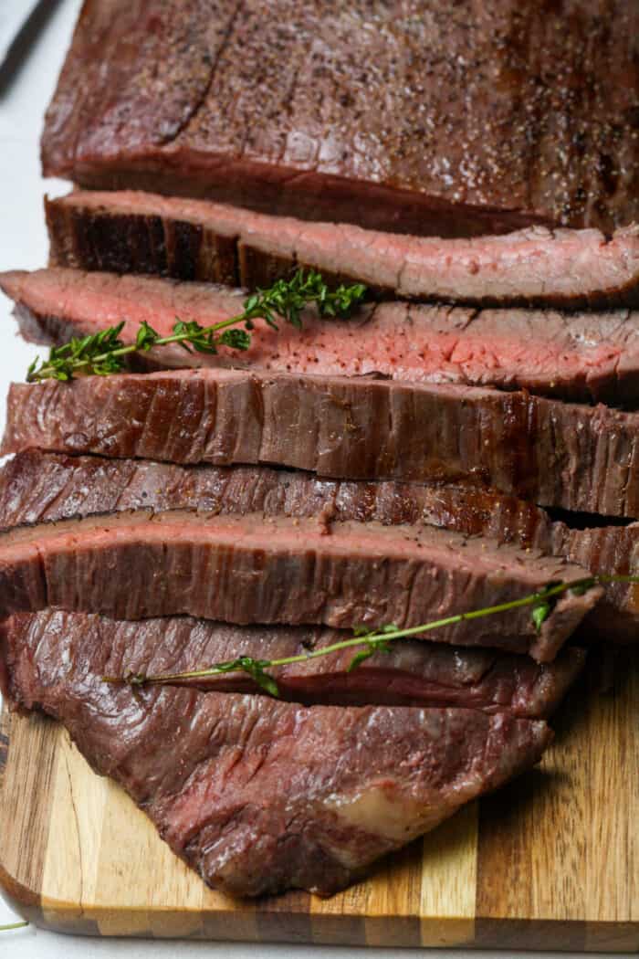 Sous vide flank steak on cutting board