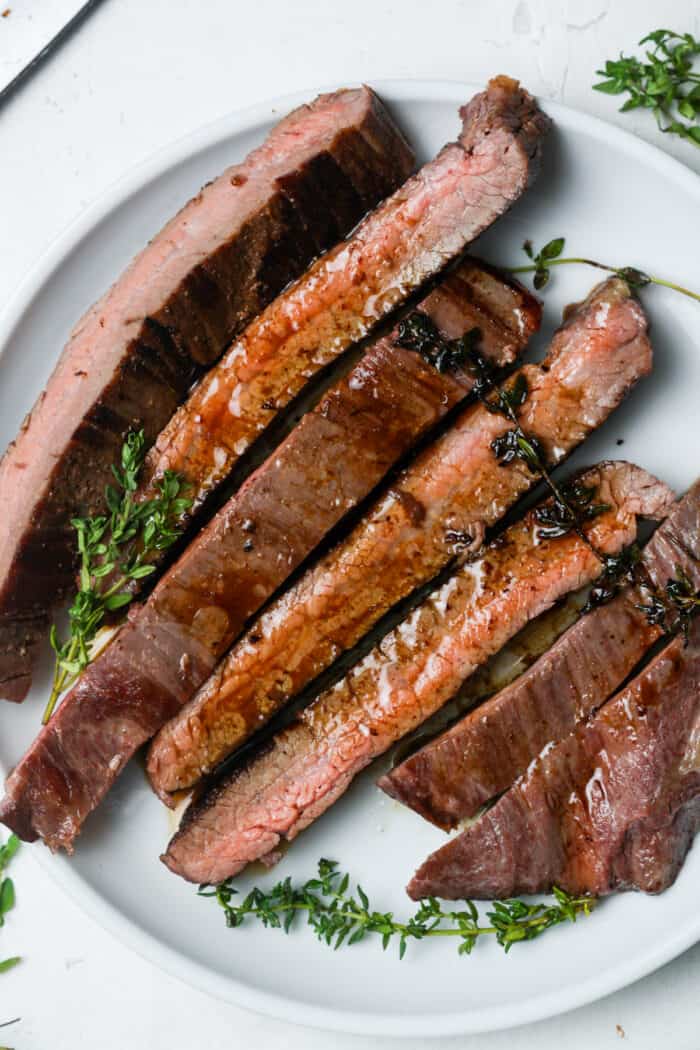 Sous vide flank steak on white plate