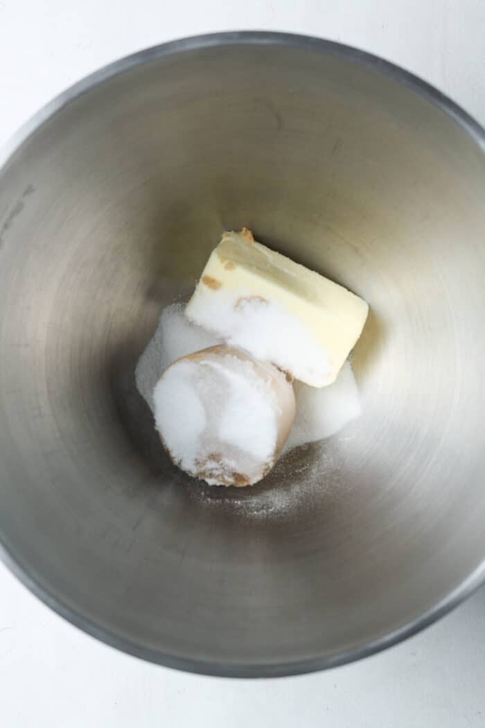 Cold butter and sugar in bowl