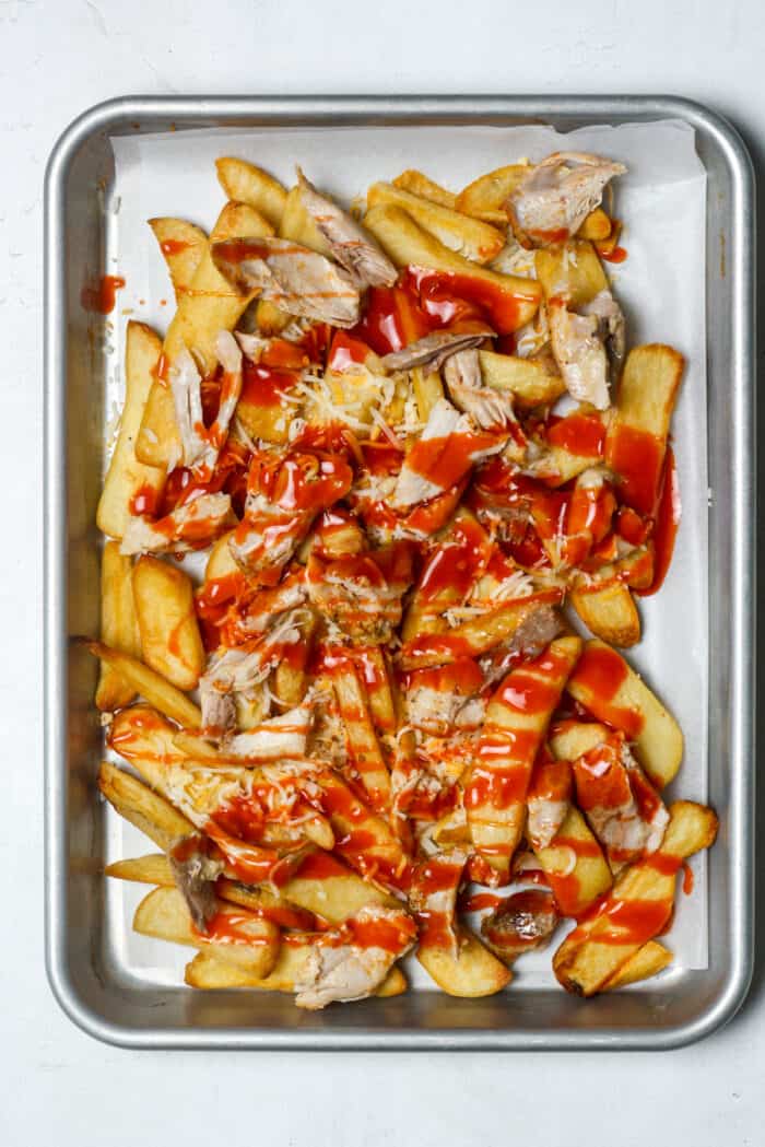 Hot sauce and chicken on fries