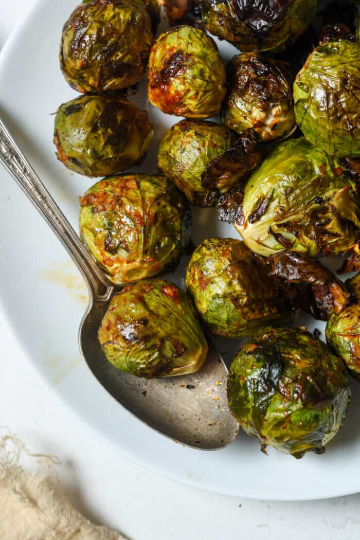 Asian Brussels sprouts on white plate