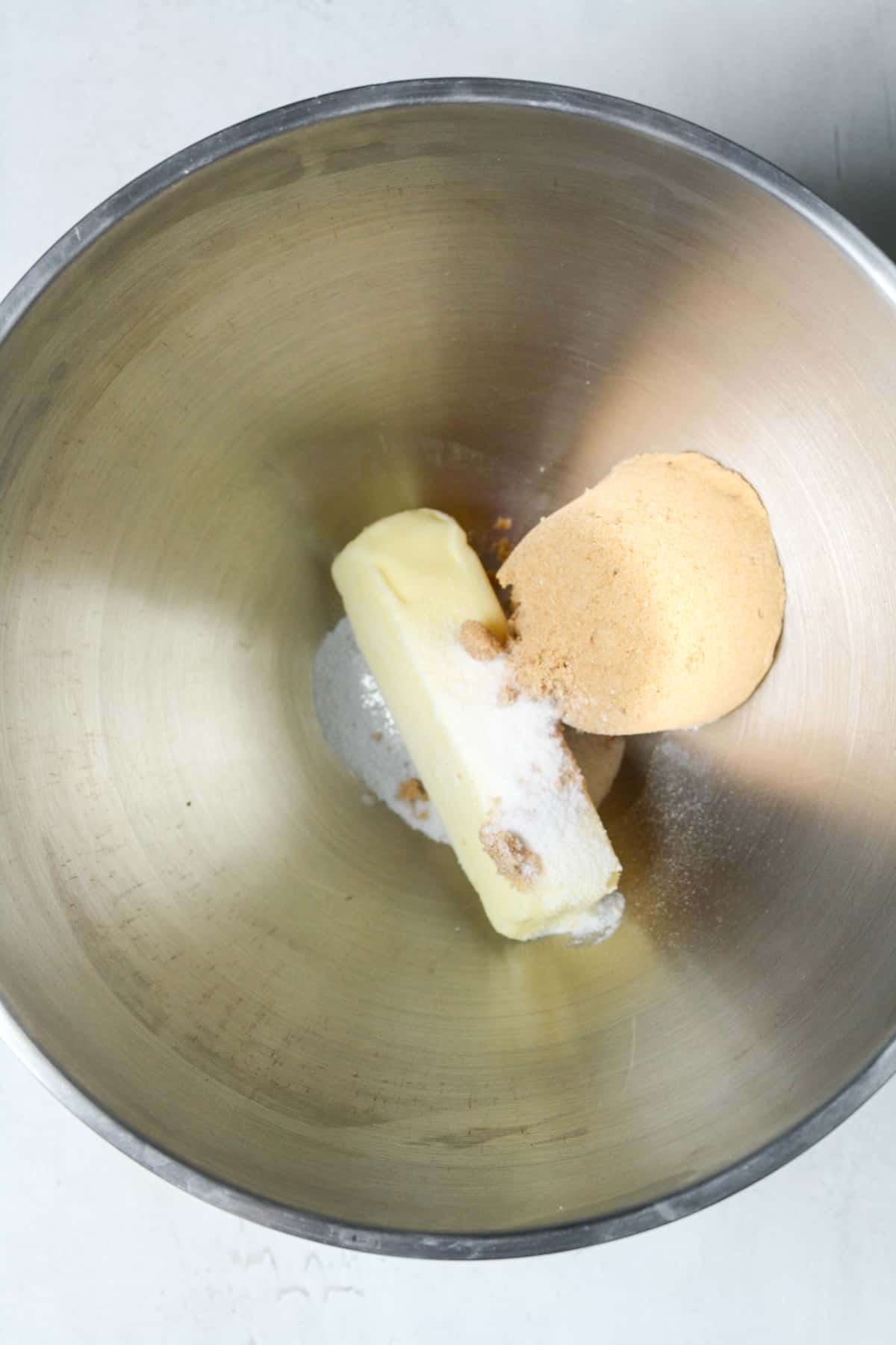 Butter and sugars in bowl