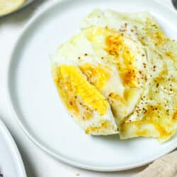 Over hard eggs on white plate