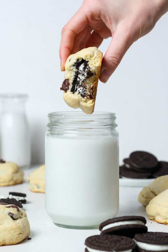Oreo stuffed cookies dunked into milk