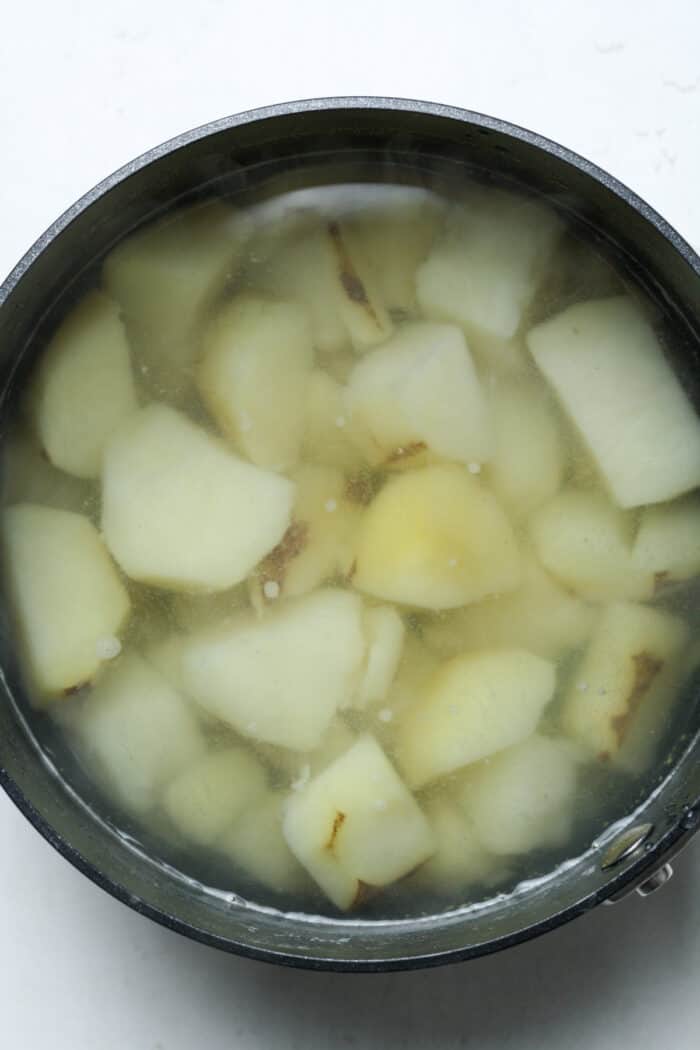 Potatoes and water in pan