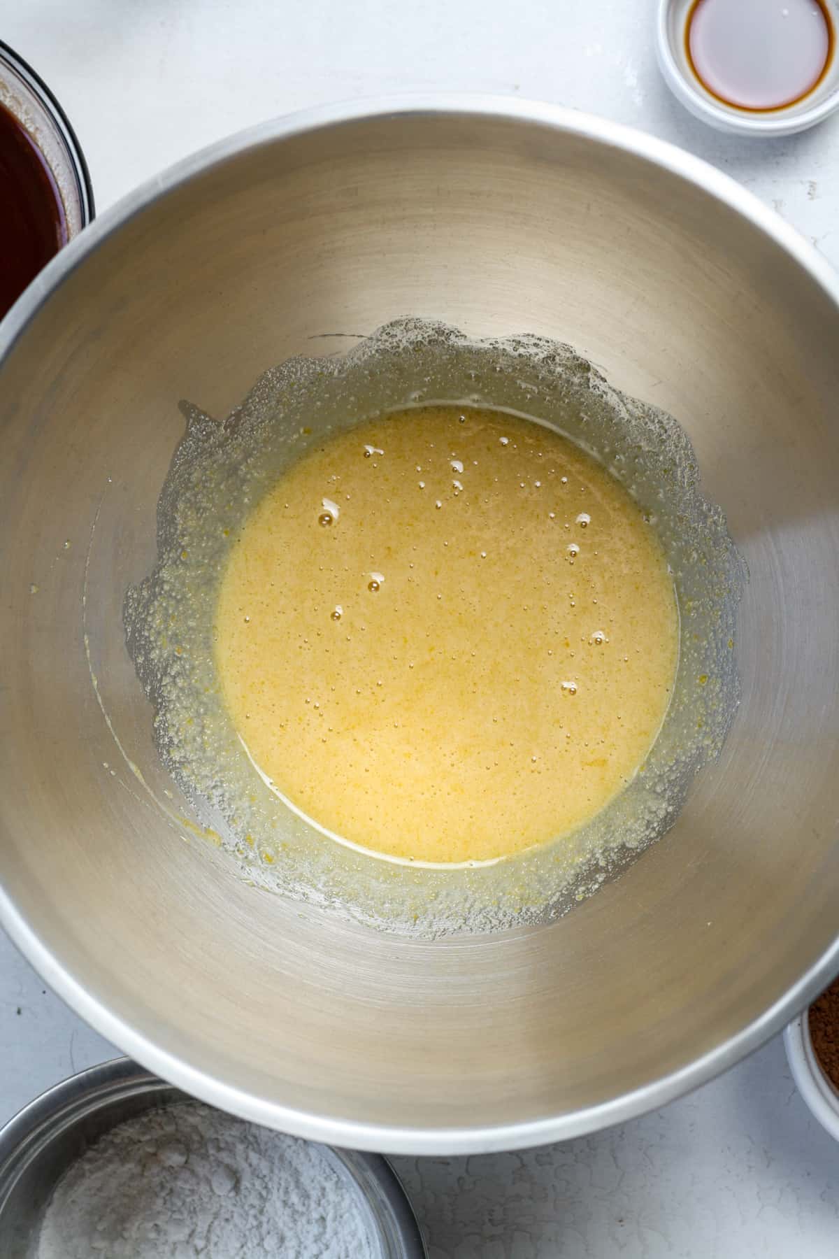 Frothy eggs and sugars in bowl