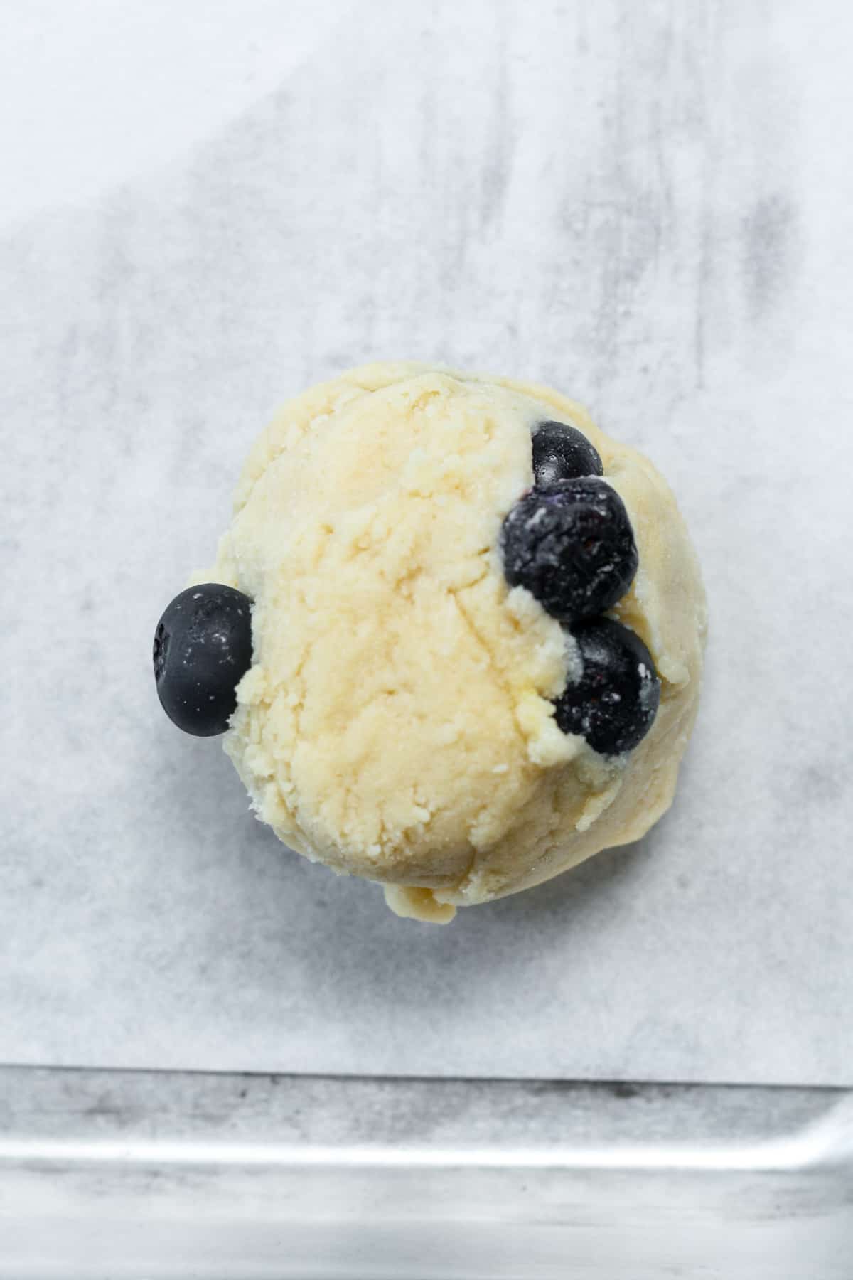 Ball of dough with blueberries