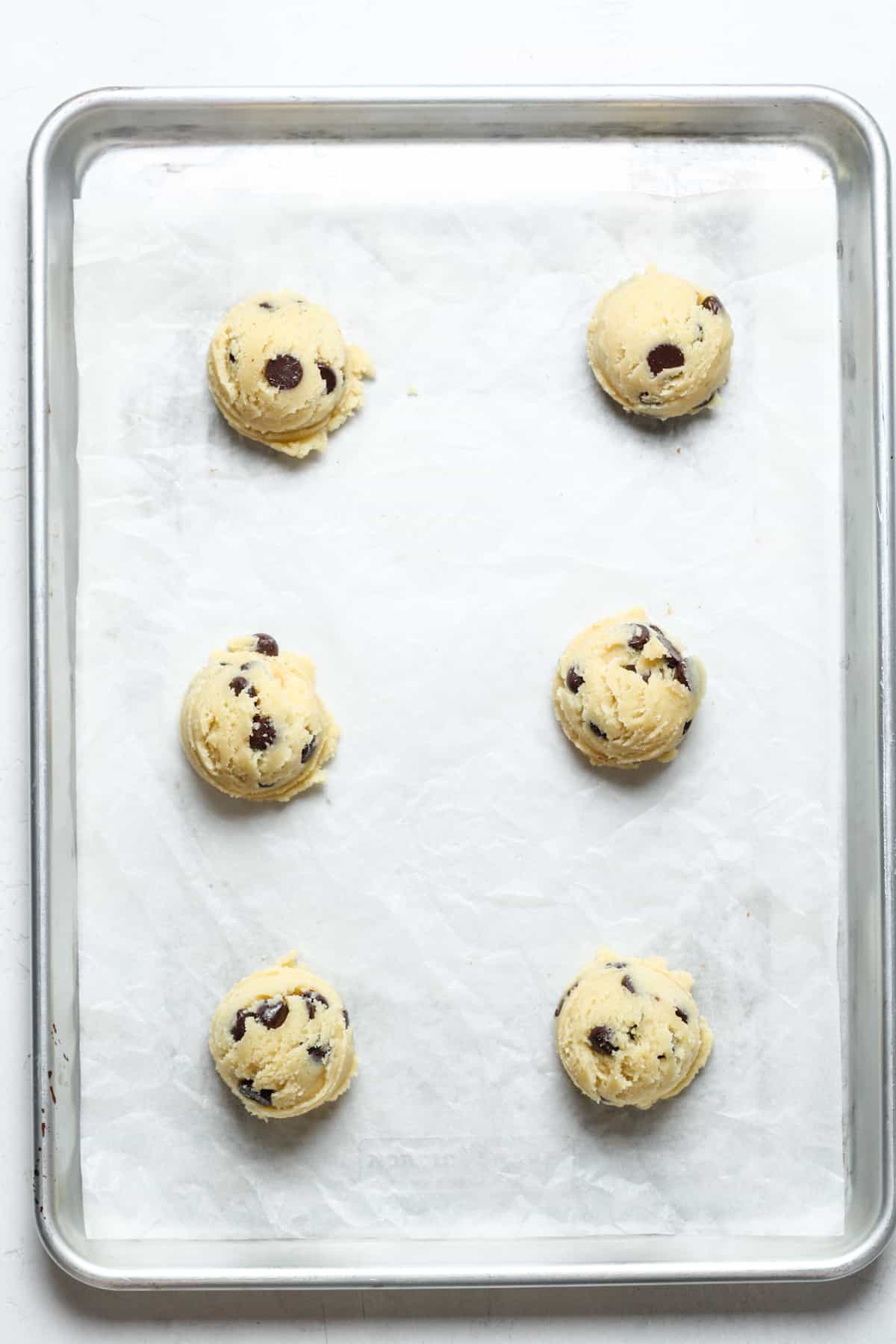 Balls of keto cookie dough on pan