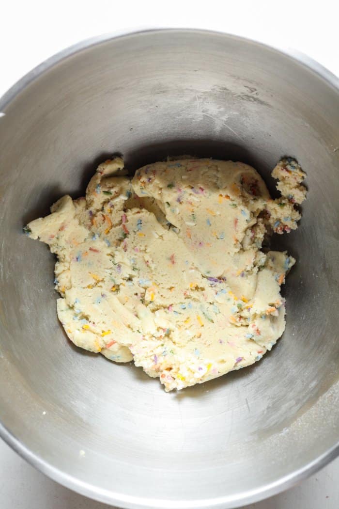 Sprinkled sugar cookie dough in bowl