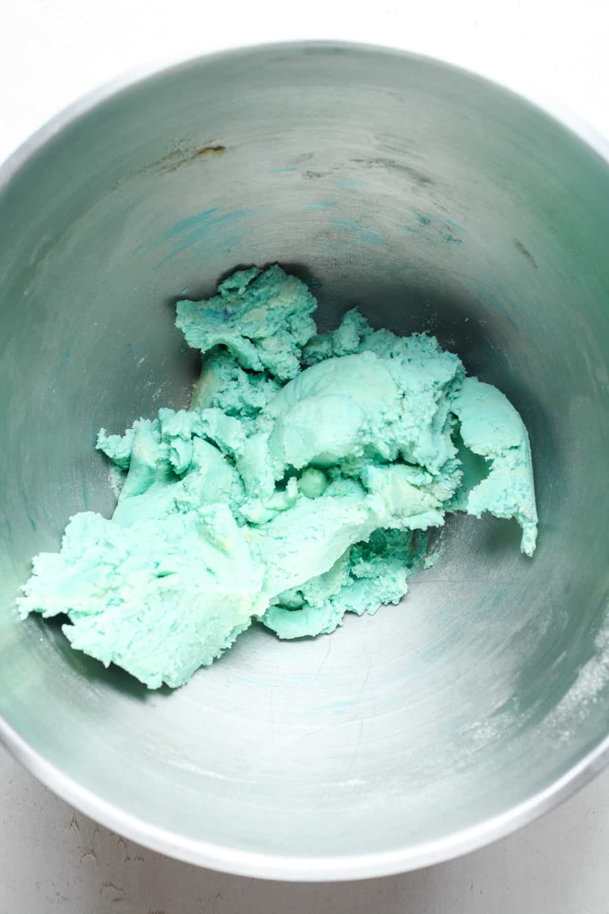 Blue cookie dough in bowl