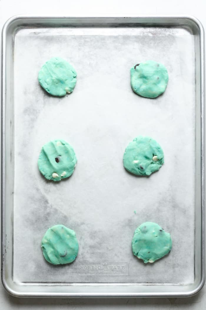 Flattened blue dough on pan