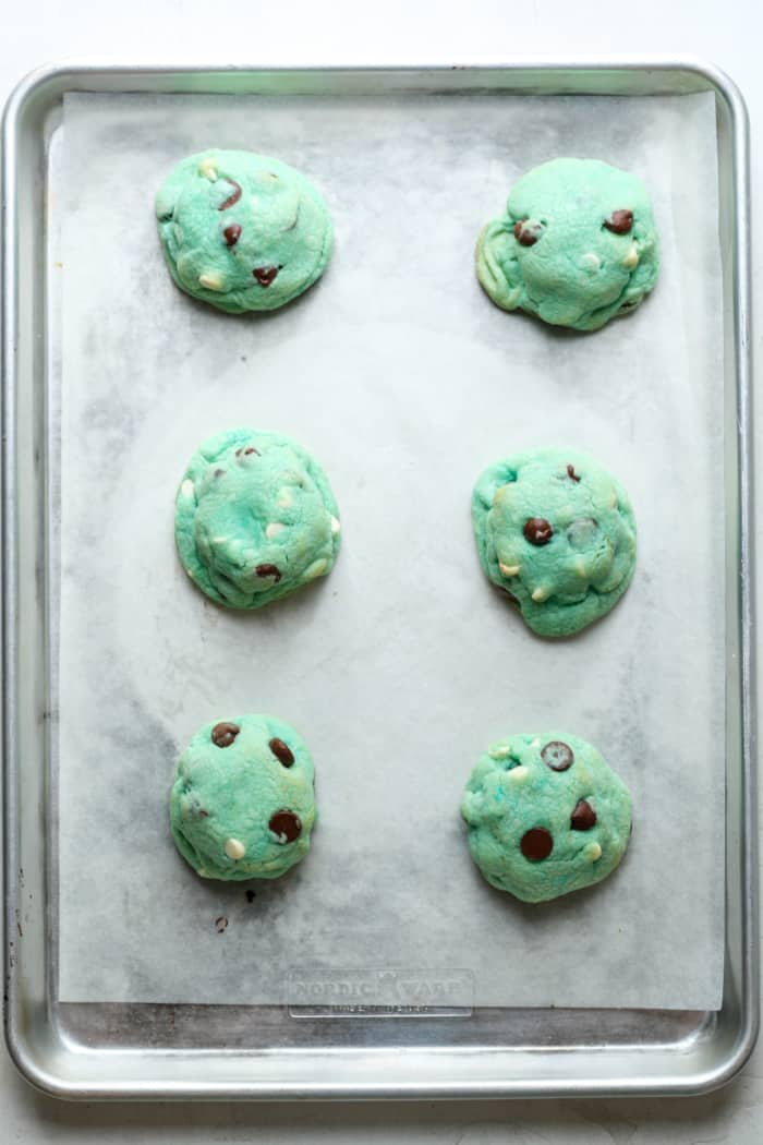 Blue chocolate chip cookies on pan