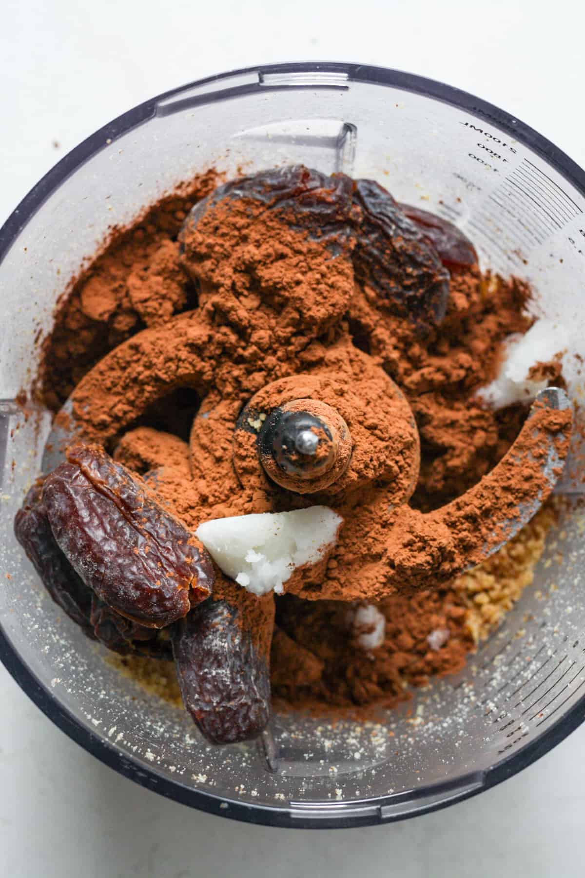 Chocolate and dates in food processor.