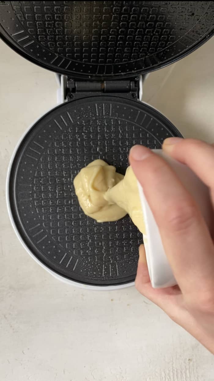 Waffle cone maker with batter.