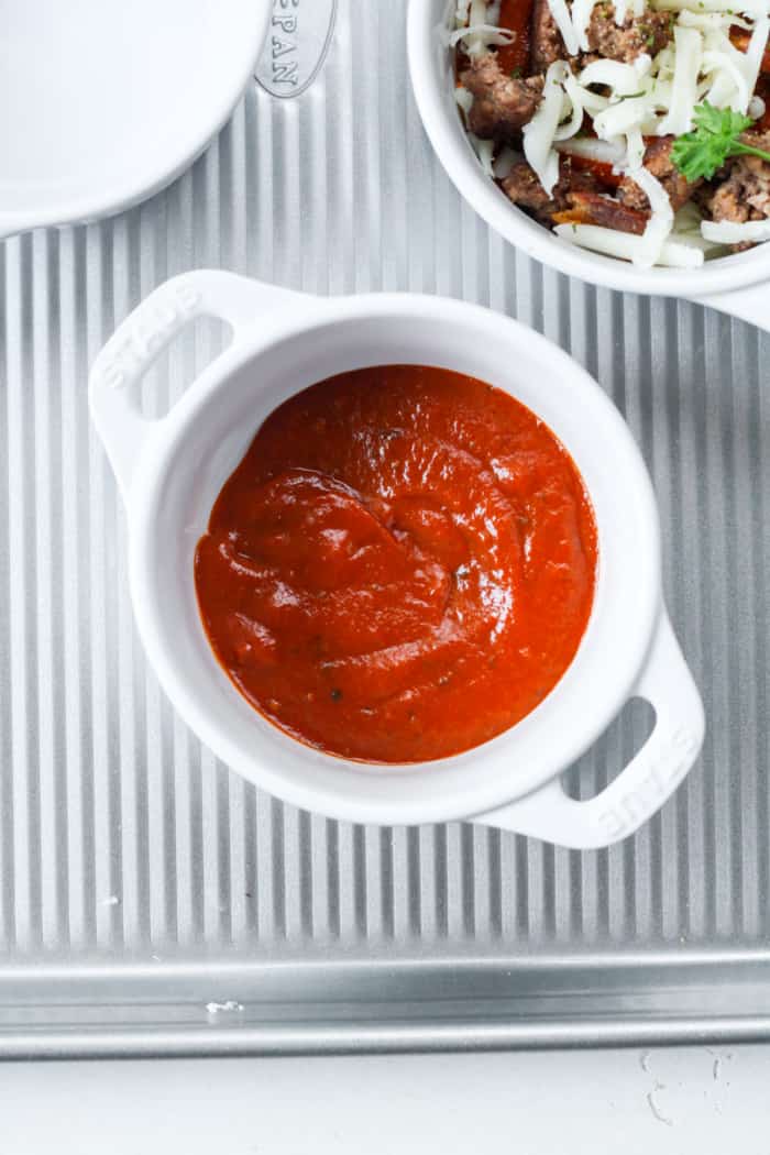 Ramekin with red sauce.