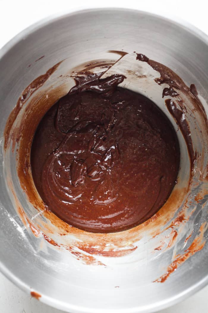 Thick brownie dough in bowl.