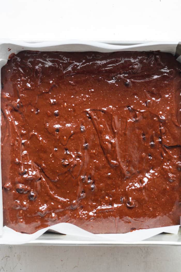 Square pan with brownie batter.