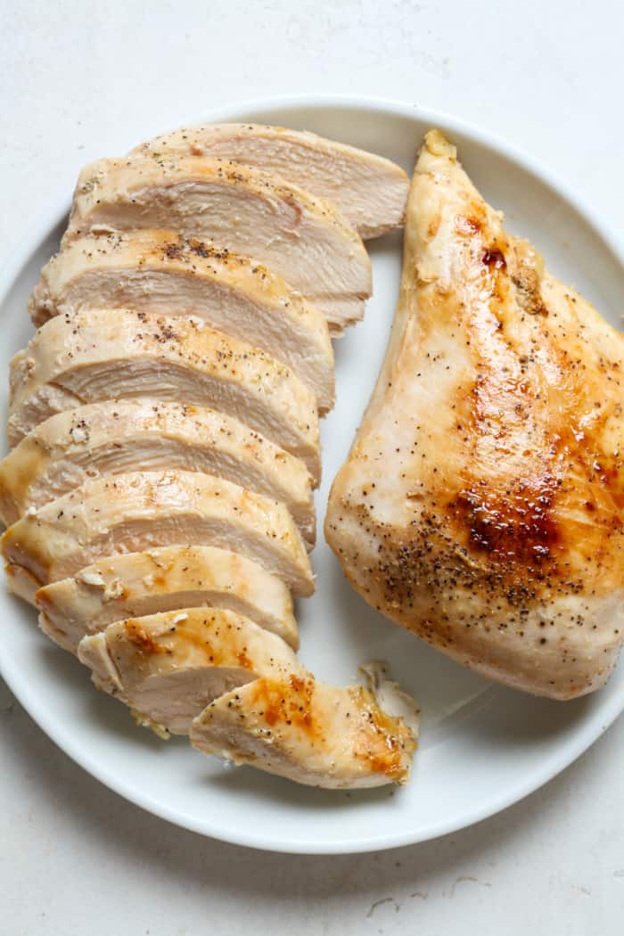 Chicken breast on plate.