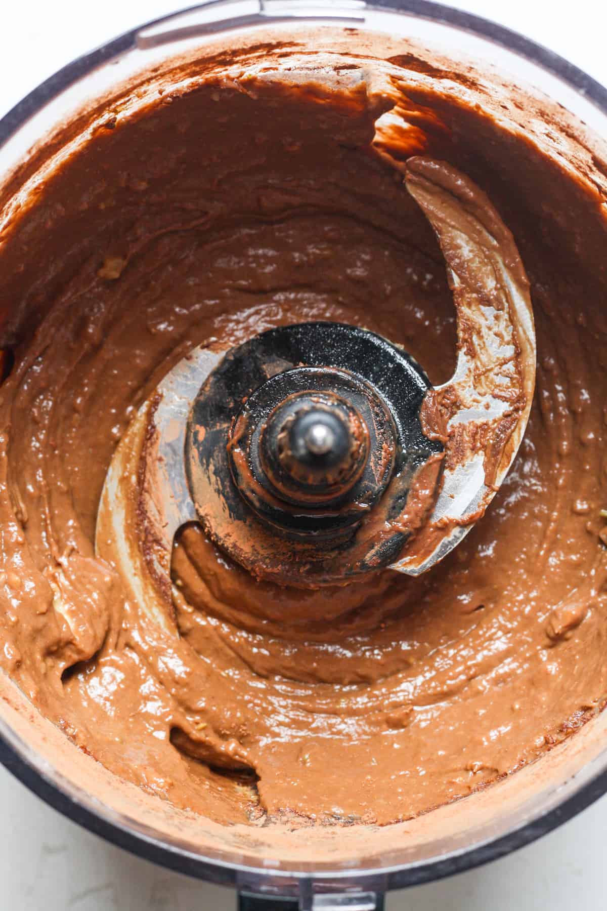 Creamy chocolate pudding in food processor.