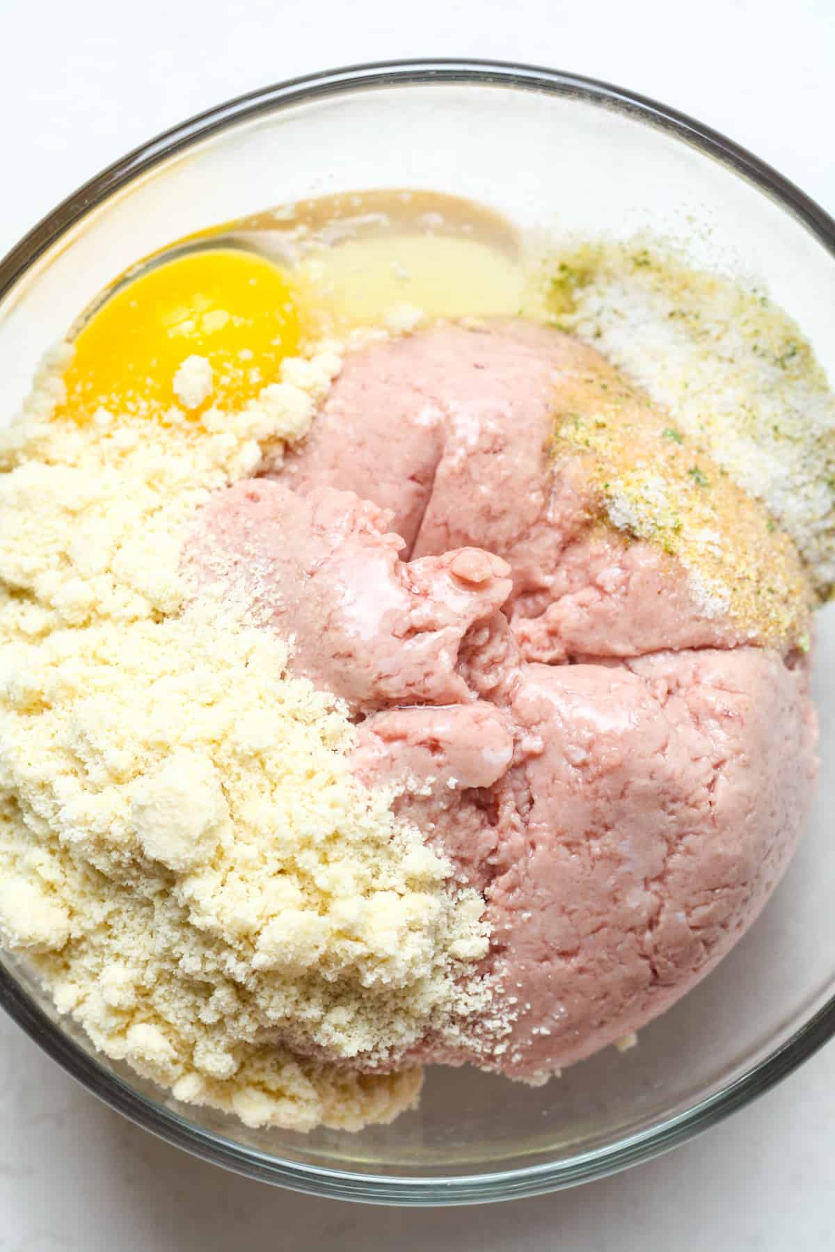 Turkey, egg and flour in bowl.