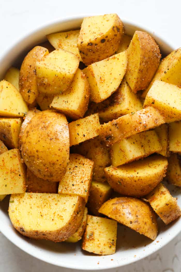 Cubed potatoes in bowl.