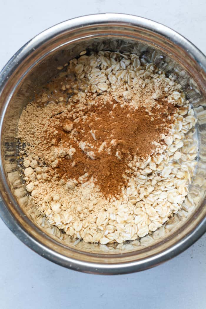 Oats and cinnamon in bowl.