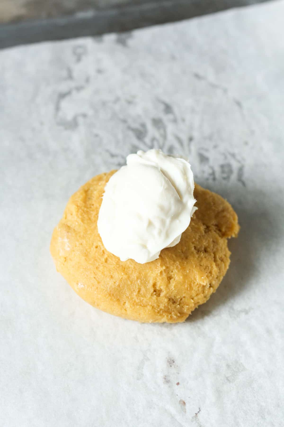 Pumpkin cookie with cream cheese.