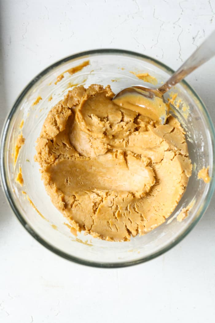 Thick peanut butter in bowl.