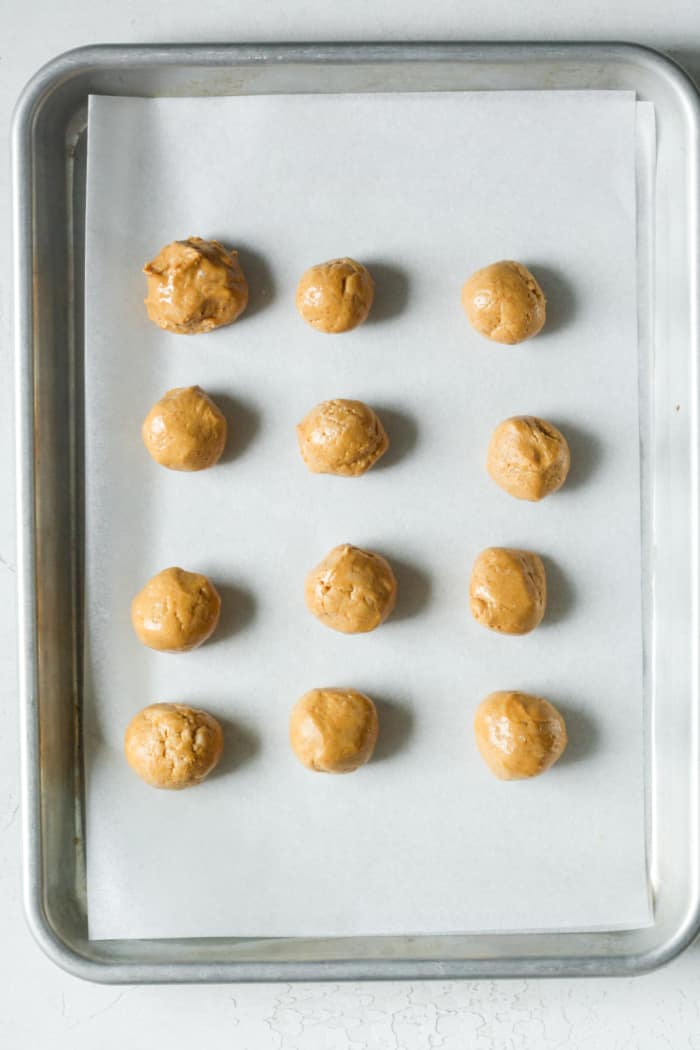 Peanut butter balls on pan.
