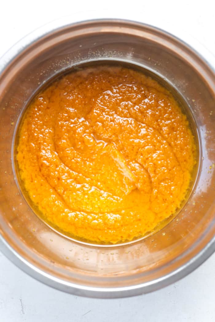 Melted oil with pumpkin in bowl.