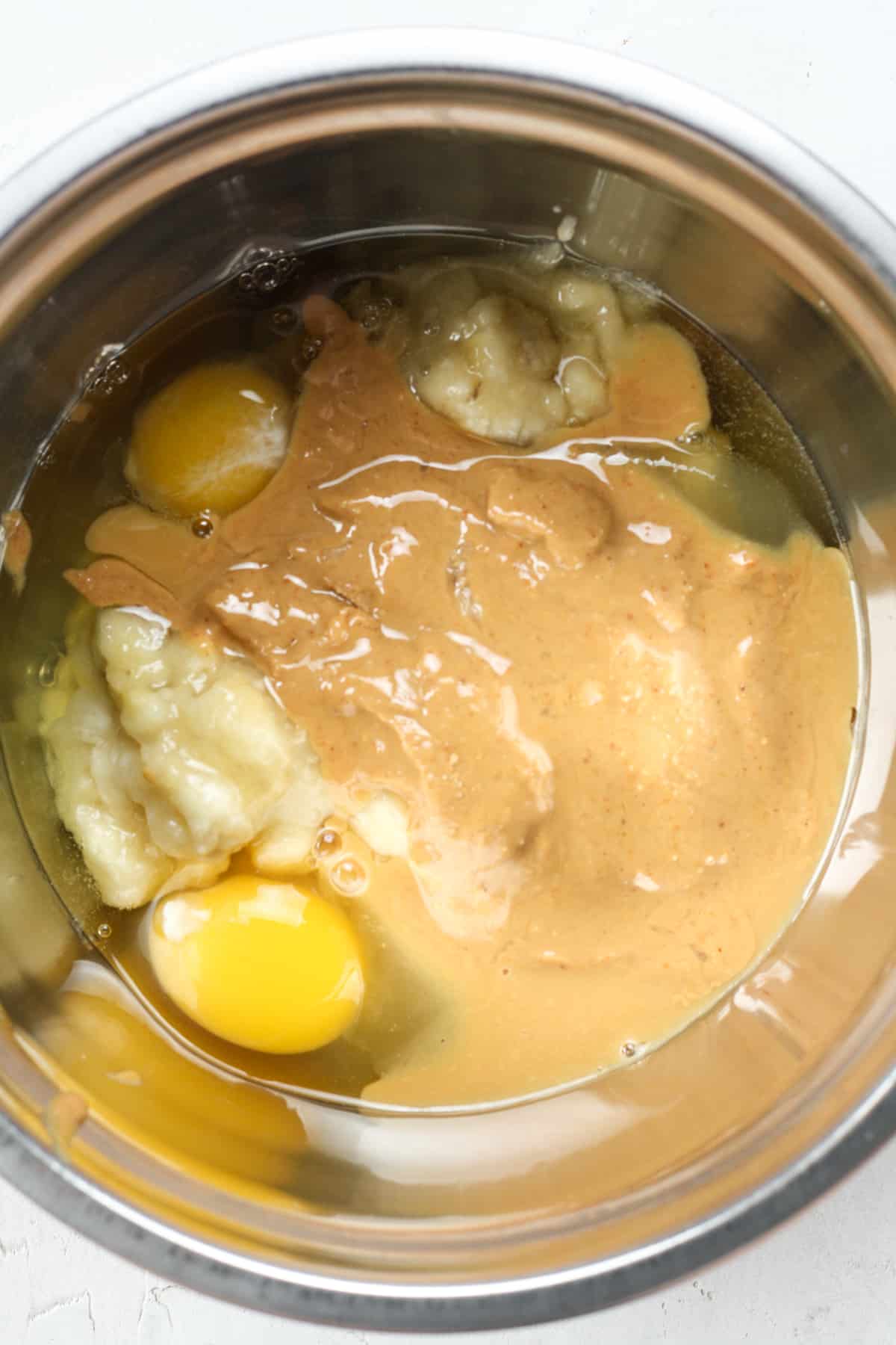Peanut butter and eggs in bowl.