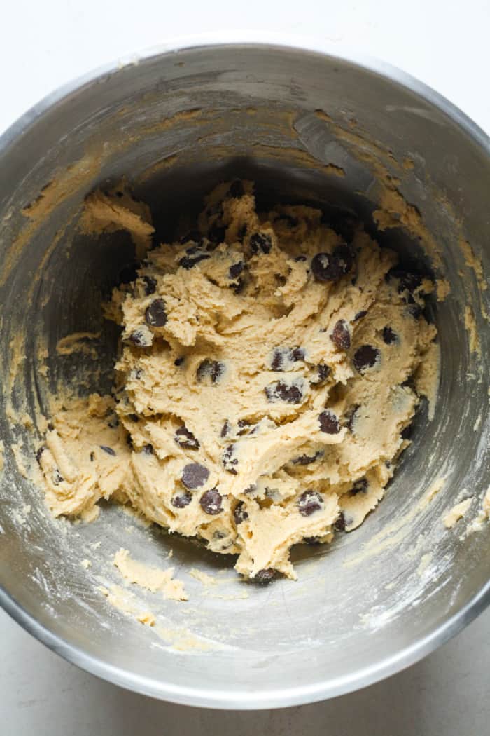 Mixing bowl of gluten free chocolate chip cookie dough.