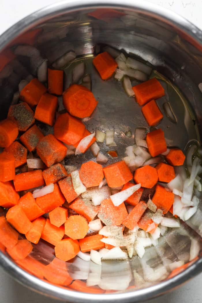 Carrots and onions in pot.