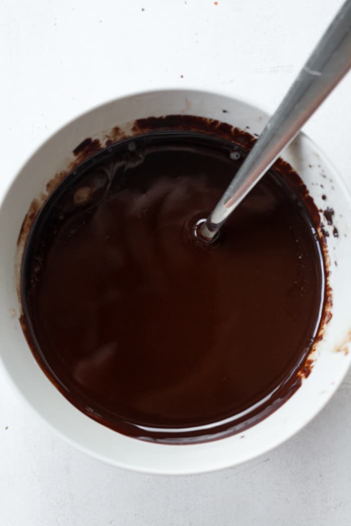 Smooth melted dark chocolate.