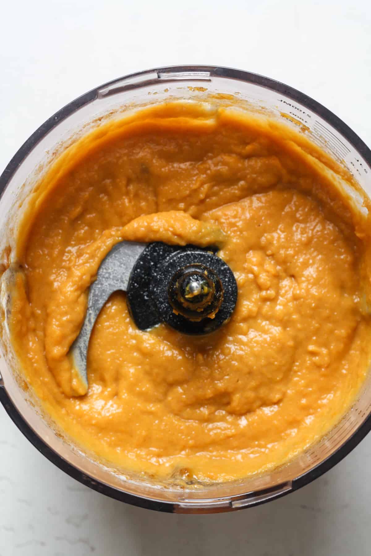 Mashed sweet potatoes in food processor.